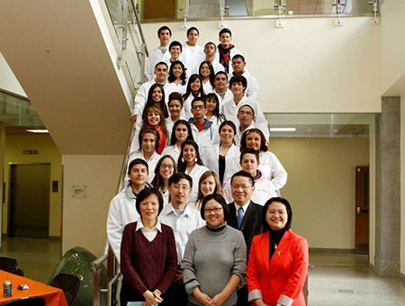 Work With a Scientist Program Director Pei-Ling Hsu, Ph.D. (front, far right) with participating scientists (from left to right) Wen-Yee Lee, Ph.D.; Lixin Jin, Ph.D.; Chuan Xio, Ph.D.; and Bill Tseng, Ph.D., stand in front of the Irvin High School students selected to participate in the program’s first year. Photo courtesy of Pei-Ling Hsu.