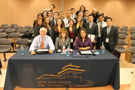 From left to right, Judges Elliot Shapleigh, former Texas State Senator; Krystal Long, CEO of GECU; and Veronica Escobar, county judge; pose with the 24 UTEP students, behind, who took on 2013’s Grand Challenge Workshop. Photo by Aaron Cervantes
